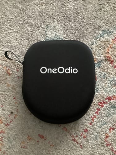 Oneodio protective carry case on a carpet