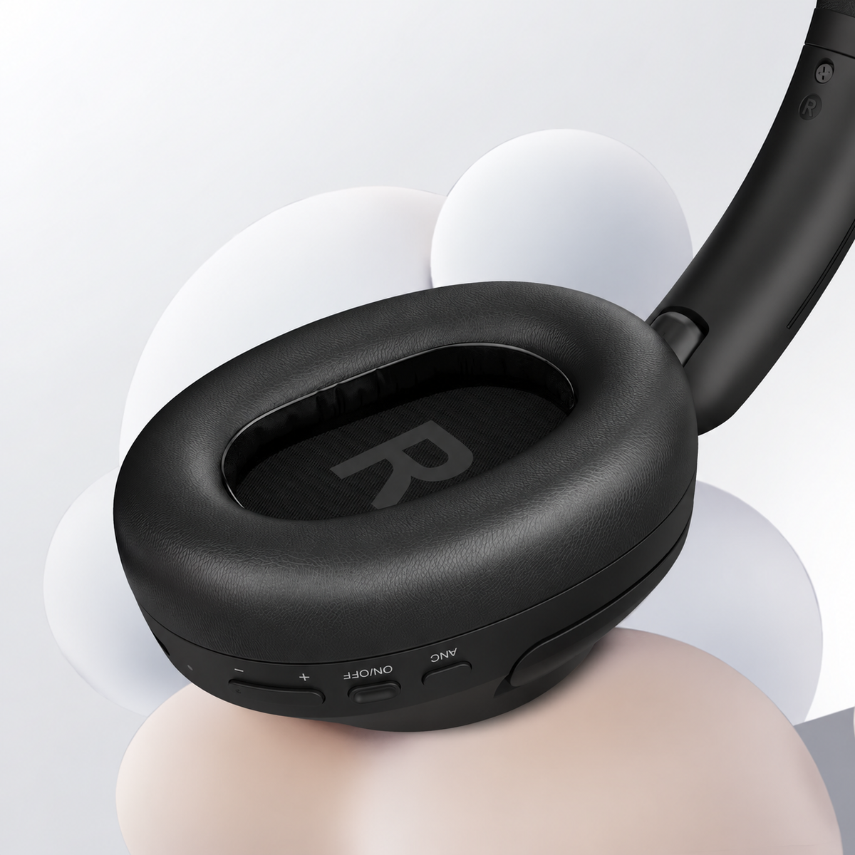 Close-up of the Focus A6 memory-foam ear cushion and physical controls